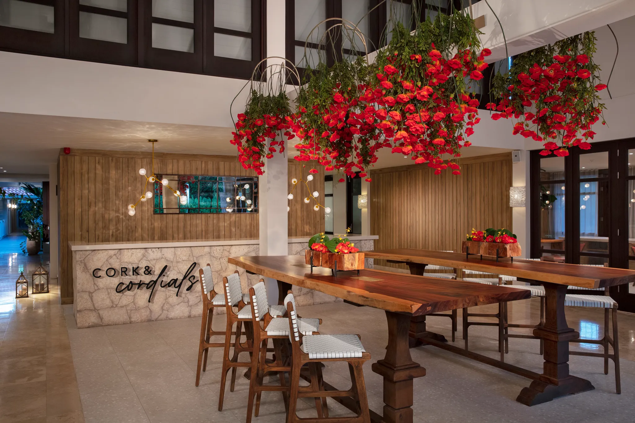 Cork & Cordials wine bar at Zoëtry Curaçao Resort & Spa featuring elegant lobby seating, curated wine selections, and a warm, sophisticated atmosphere.