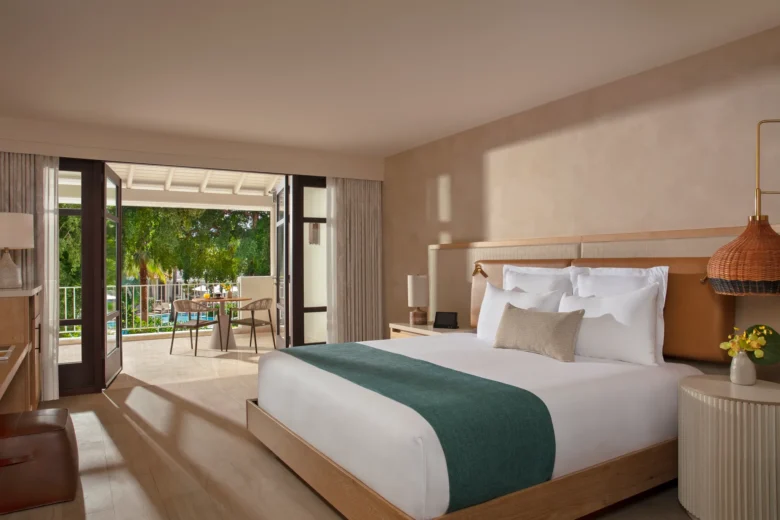 Junior Suite Pool View with king bed and private terrace at Zoëtry Curaçao Resort & Spa.