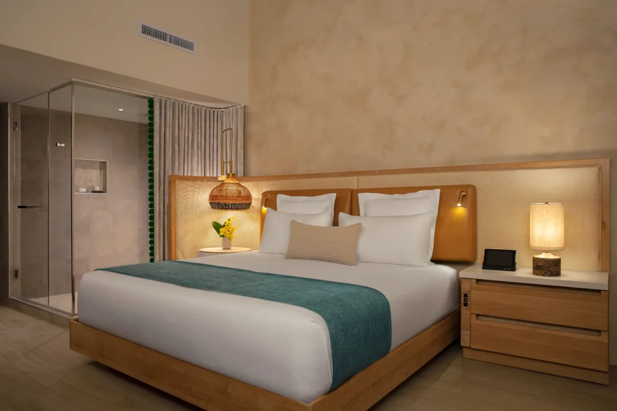 Master Suite Tropical Garden View bedroom with king bed and walk-in shower at Zoëtry Curaçao Resort & Spa.