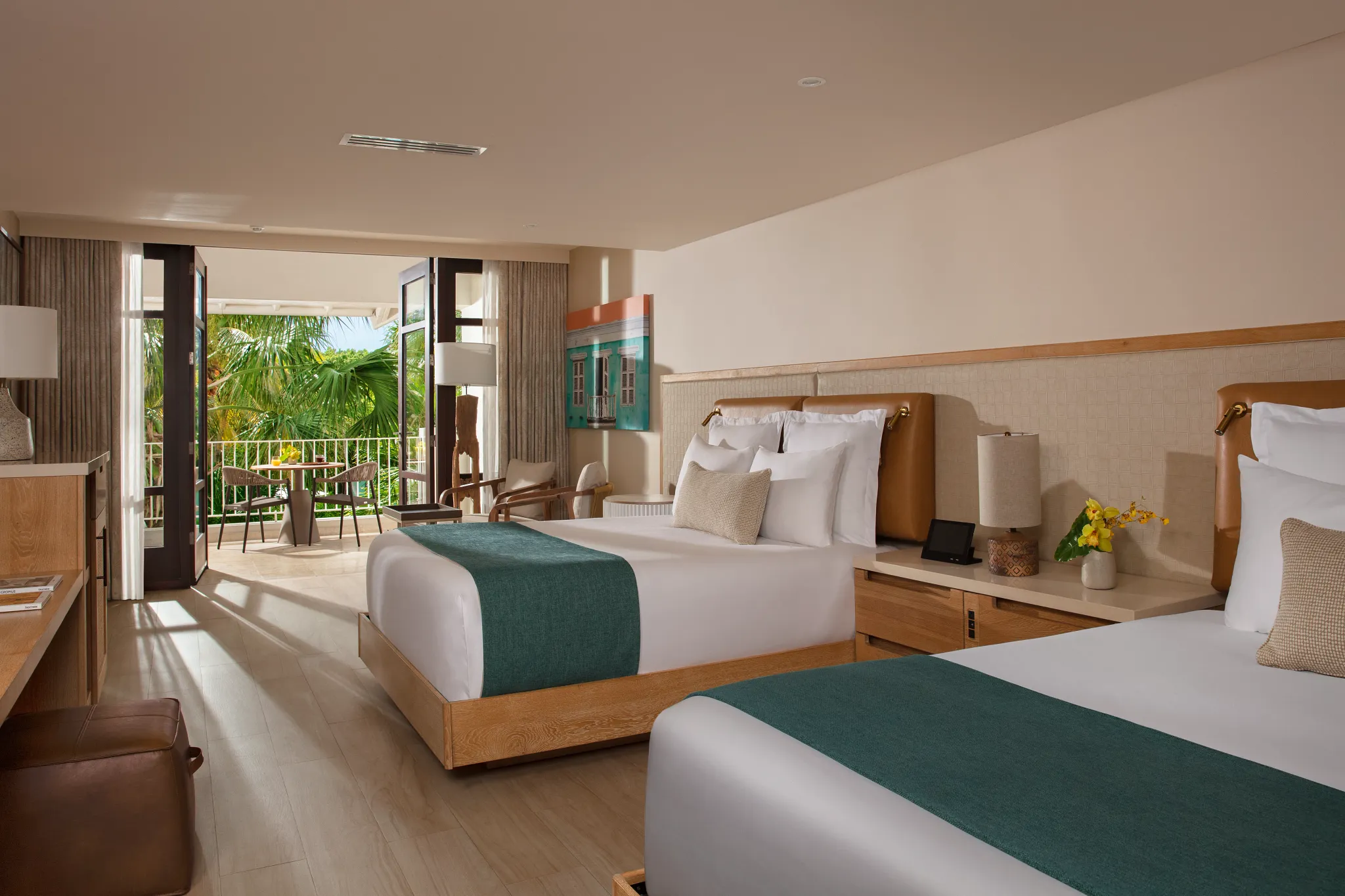 Master Suite Tropical Garden View with two queen beds at Zoëtry Curaçao Resort & Spa.