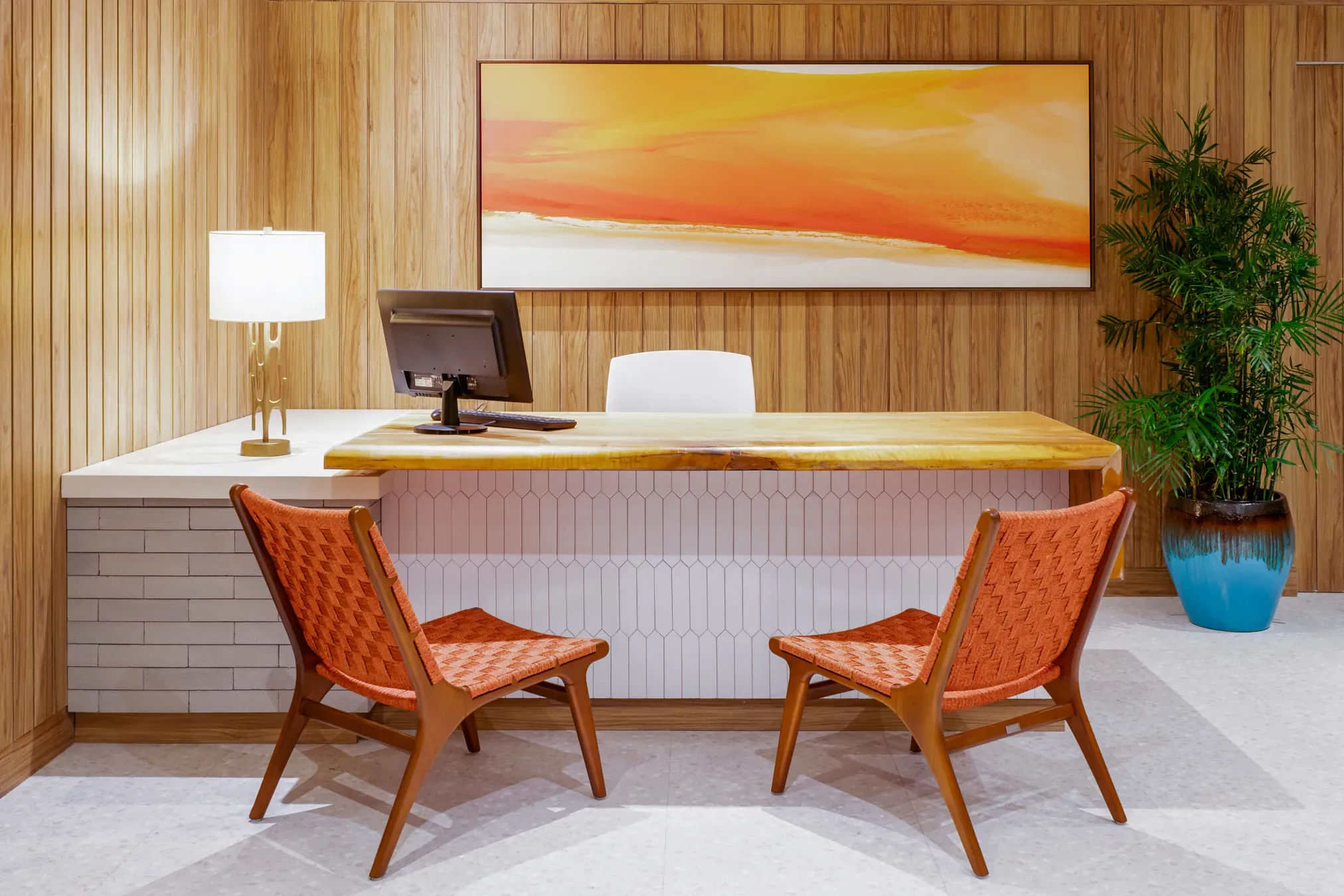 Elegant reception area with natural wood accents at Zoëtry Curaçao Resort & Spa, offering personalized guest service.