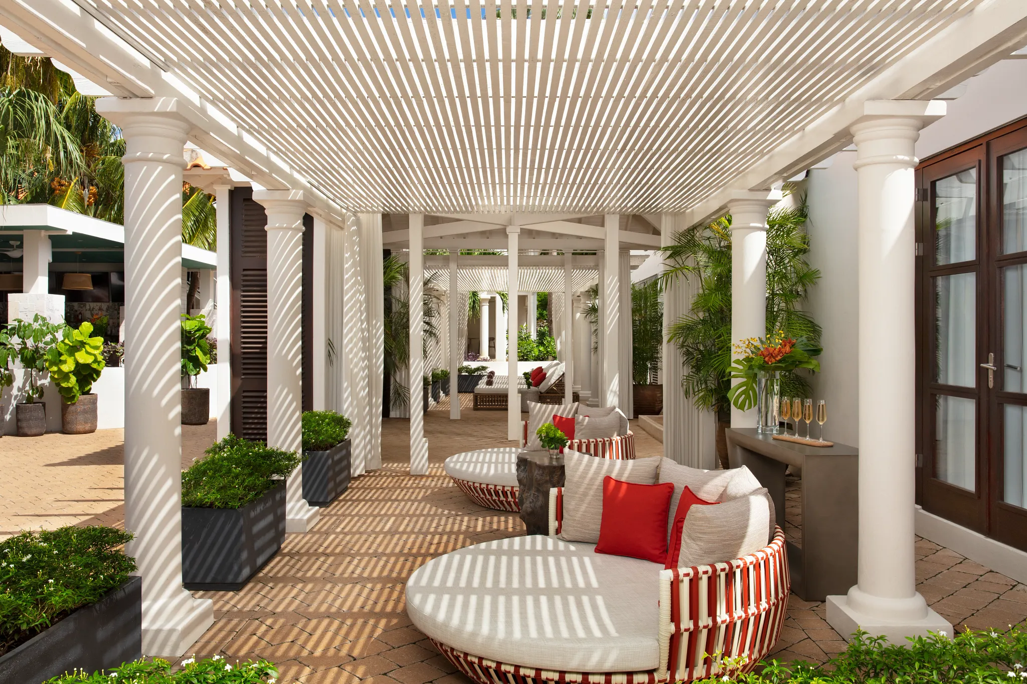 Peaceful spa relaxation area with shaded seating at Zoëtry Curaçao Resort & Spa, designed for wellness and rejuvenation.